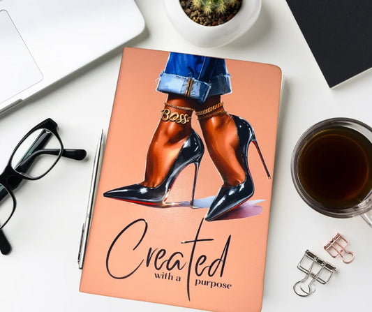 Pink hardcover “Created With a Purpose” journal styled on desk with accessories — empowering A5 notebook